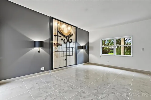 an empty room with windows and closet