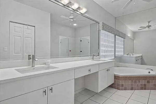 a bathroom with a sink double vanity and a mirror