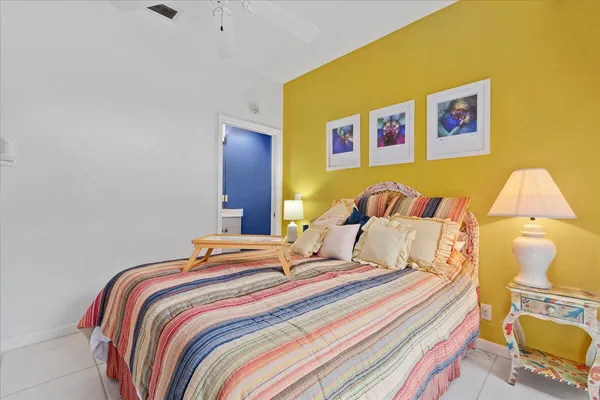 a bedroom with bed and a night stand