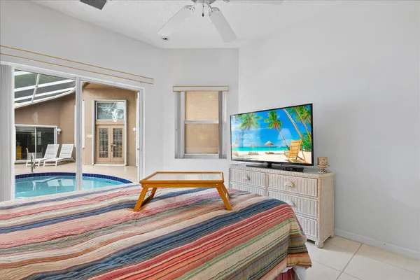 a living room with furniture flat screen tv and a fireplace
