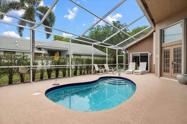 a view of a swimming pool with a patio