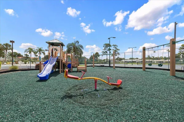 a view of a park with swings and slides