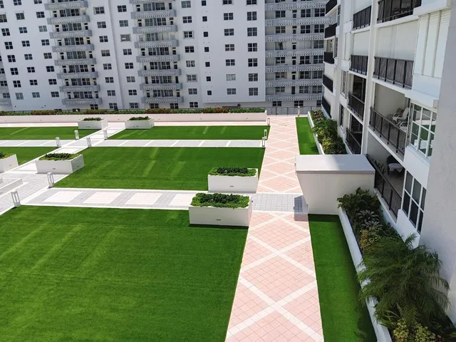 a view of a swimming pool with a garden