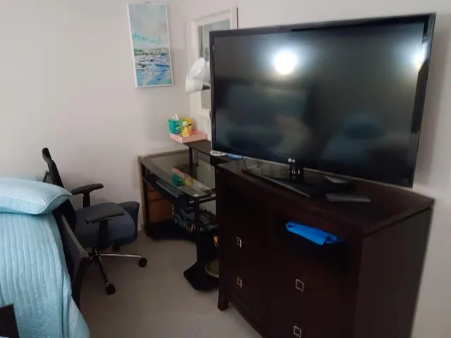 a view of a workspace with furniture