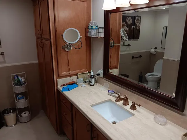 a bathroom with a sink double vanity and a mirror