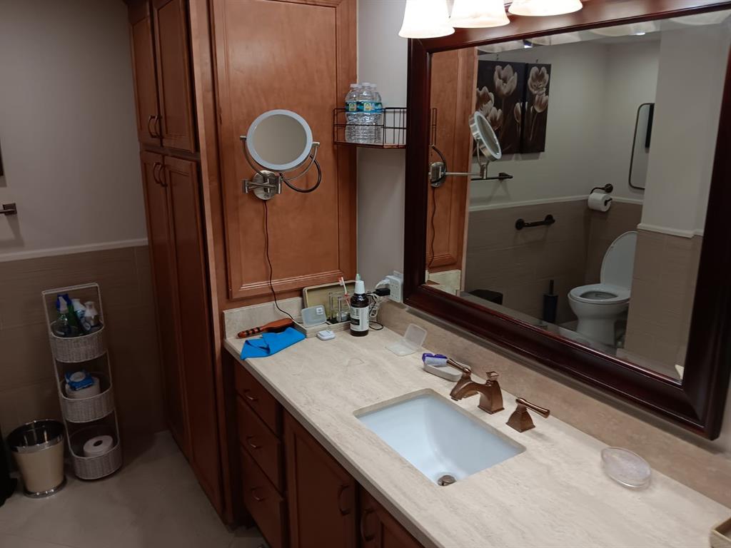 4280 Galt Ocean Drive, Unit 4G Fort Lauderdale, FL 33308 - Photo 16 of 24 a bathroom with a sink double vanity and a mirror