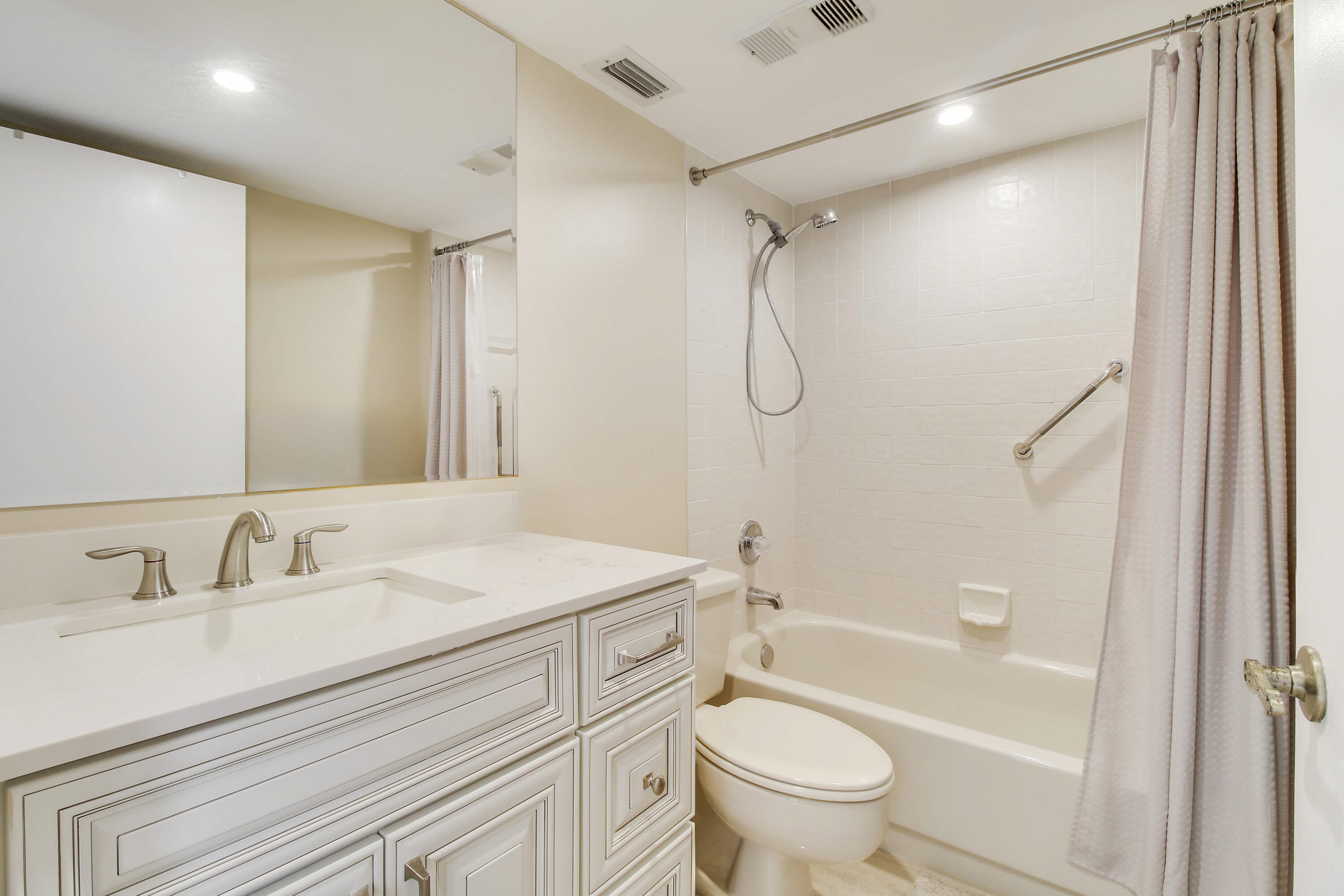 7201 Promenade Drive, Unit 301 Boca Raton, FL 33433 - Photo 26 of 40 a bathroom with a sink a toilet and a bathtub