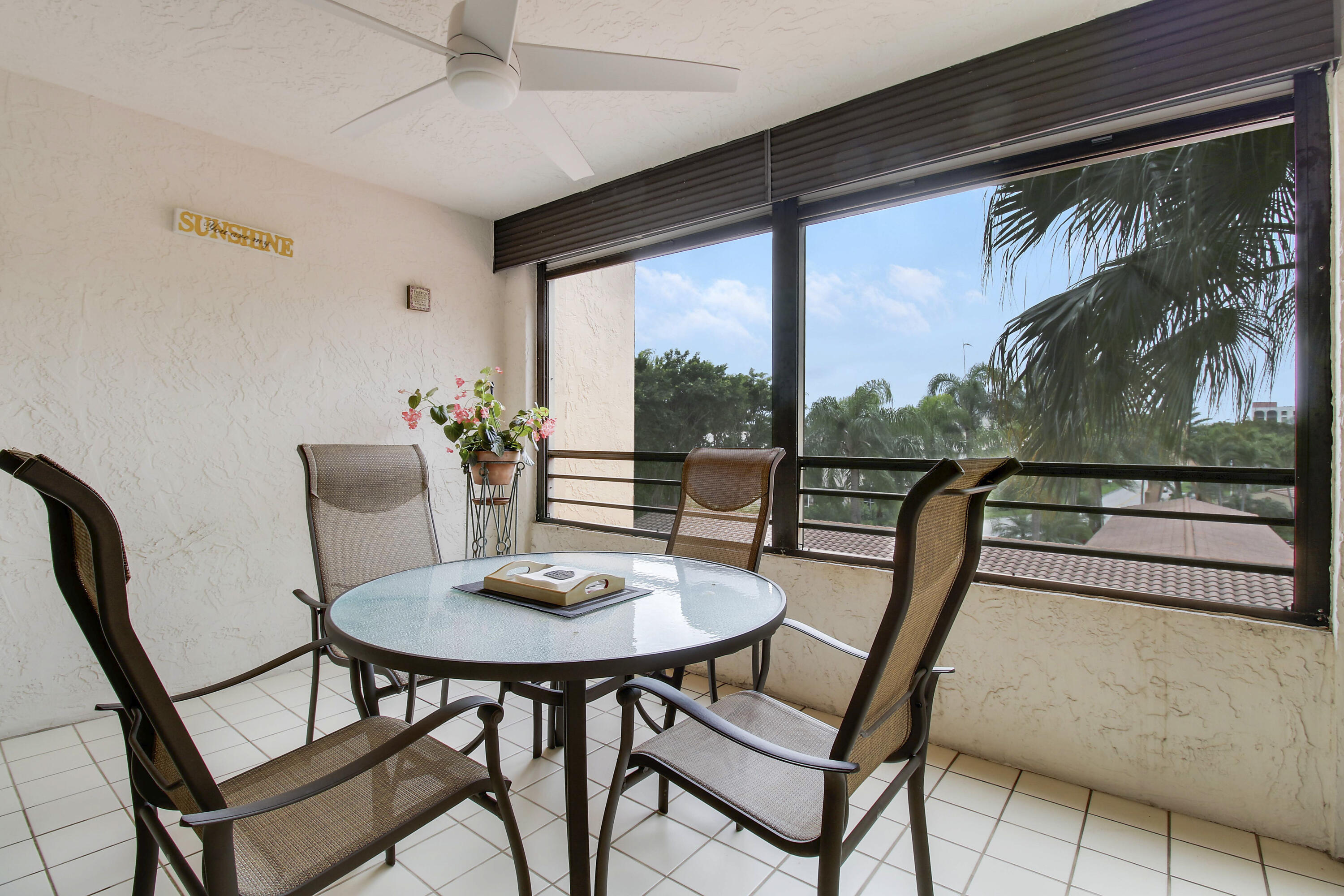7201 Promenade Drive, Unit 301 Boca Raton, FL 33433 - Photo 30 of 40 a view of a dining room with furniture window and outside view