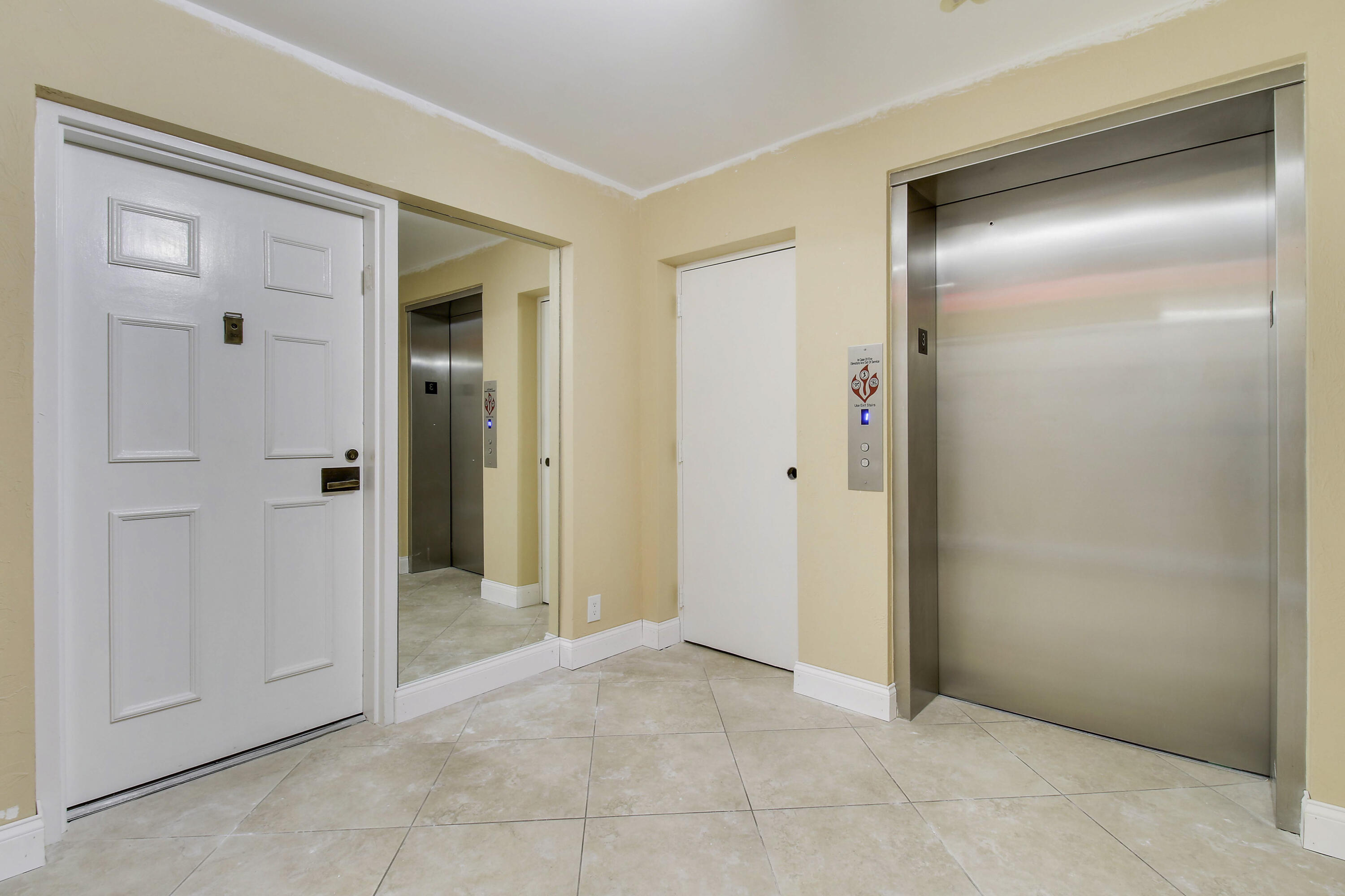 7201 Promenade Drive, Unit 301 Boca Raton, FL 33433 - Photo 31 of 40 a view of an empty room with closet and mirror