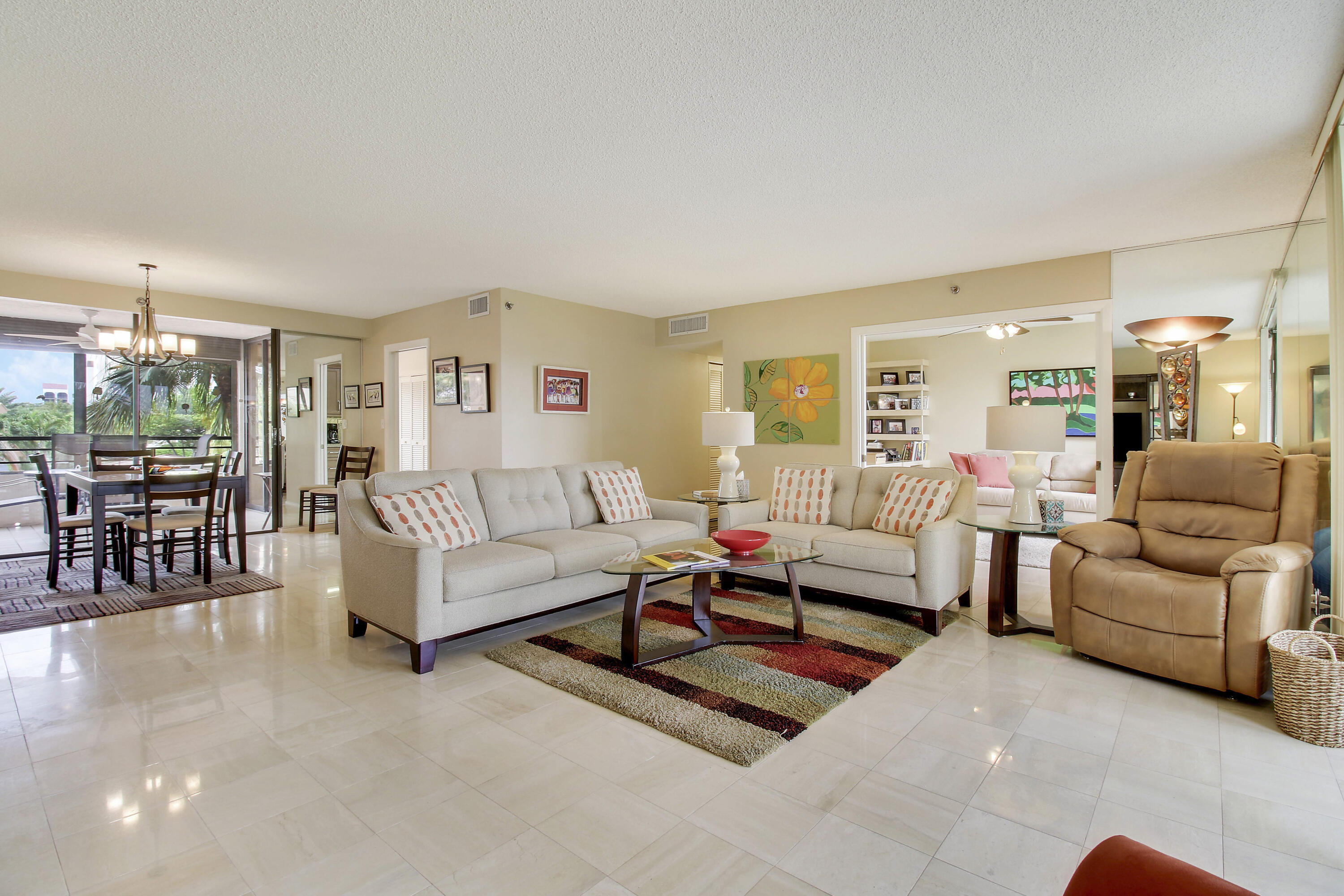 7201 Promenade Drive, Unit 301 Boca Raton, FL 33433 - Photo 8 of 40 a living room with furniture and a large window