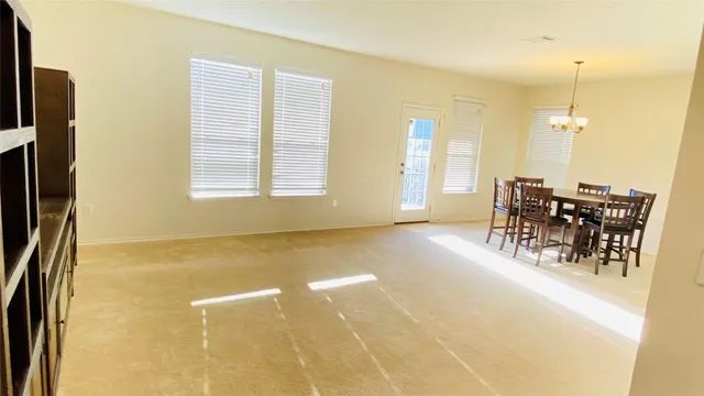 a view of a livingroom with furniture and window