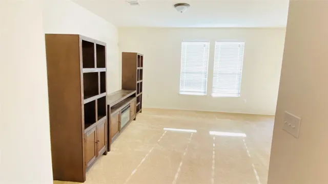 a view of kitchen and utility room with windows