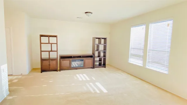 a view of a room with cabinet and windows