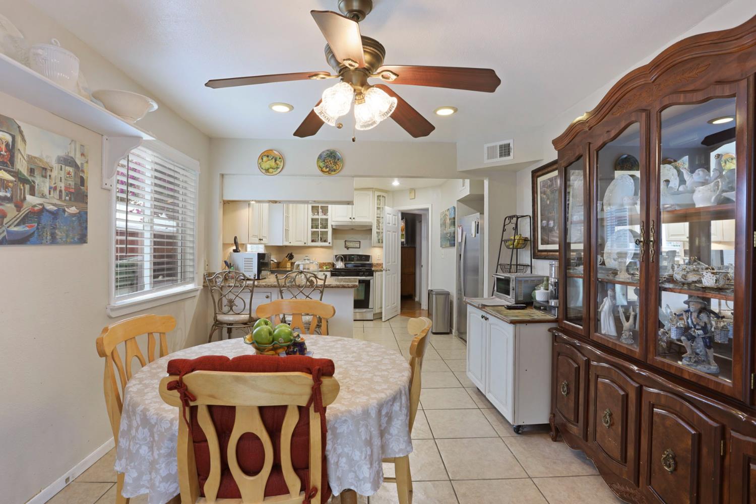 1601 Spring Court Tracy, CA 95376 - Photo 13 of 49 a view of a dining room with furniture window and wooden floor