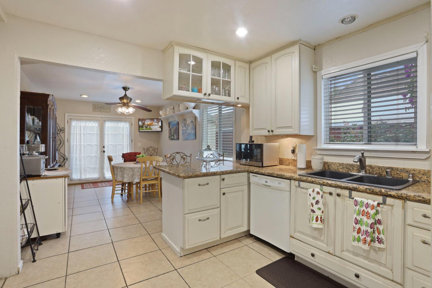 1601 Spring Court Tracy, CA 95376 - Photo 17 of 49 a kitchen with stainless steel appliances granite countertop a sink and cabinets