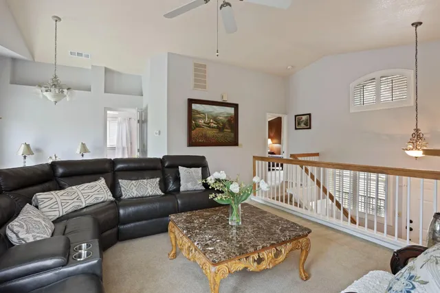 a living room with furniture and a table