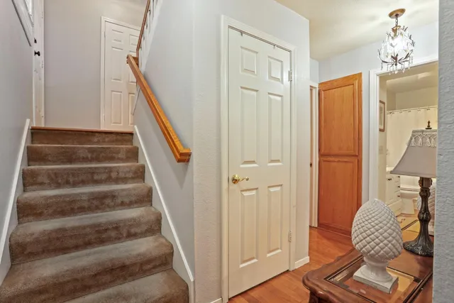 a view of entryway and hall with wooden floor