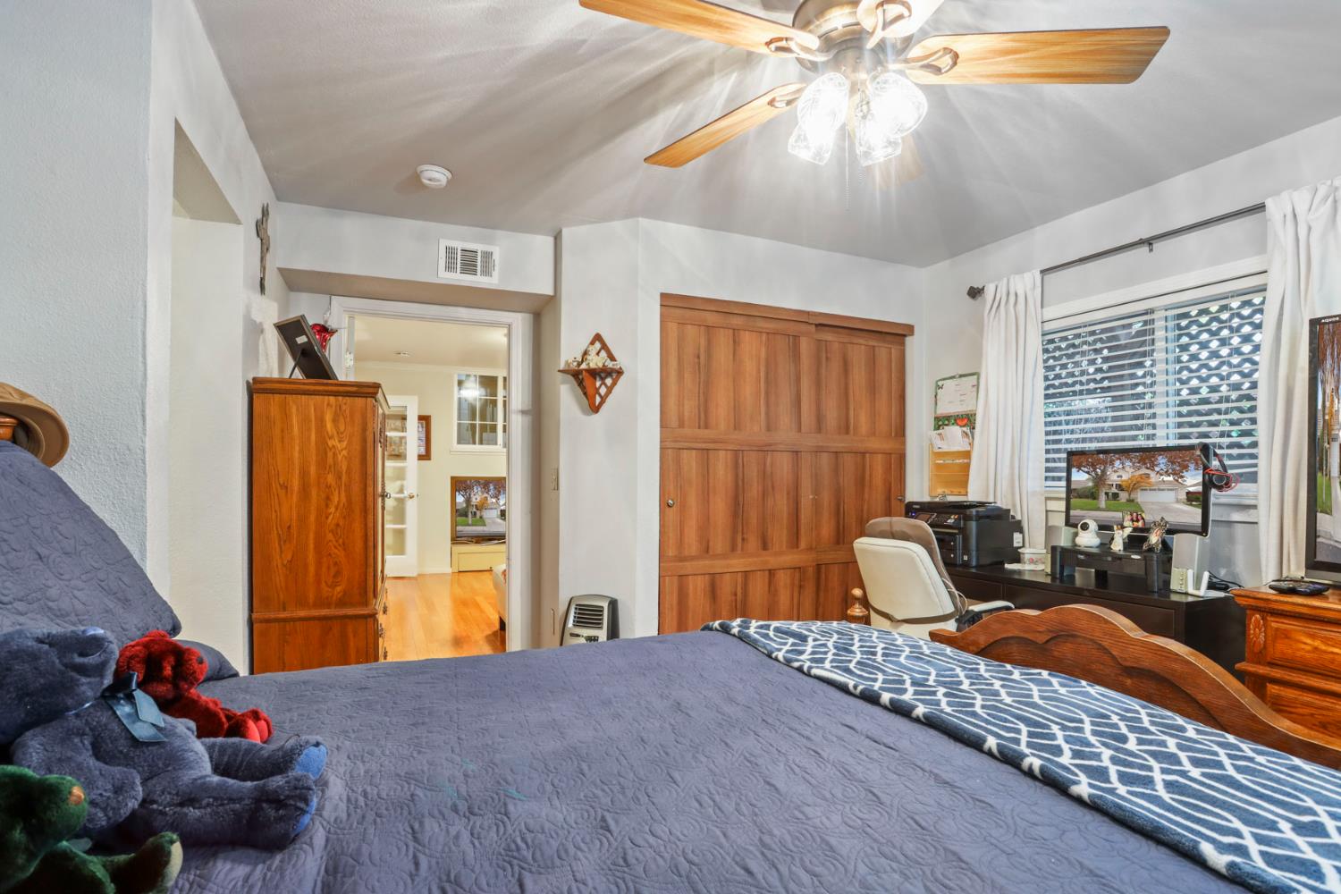 1601 Spring Court Tracy, CA 95376 - Photo 30 of 49 a bedroom with a bed dresser and a window