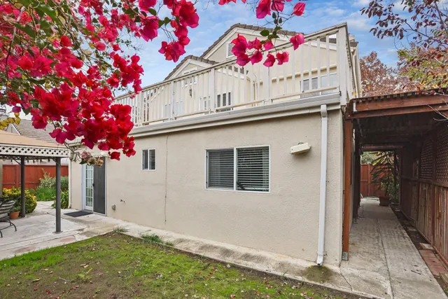 a view of a patio with table and chairs and potted plants