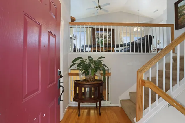 a view of balcony with furniture and wooden floor