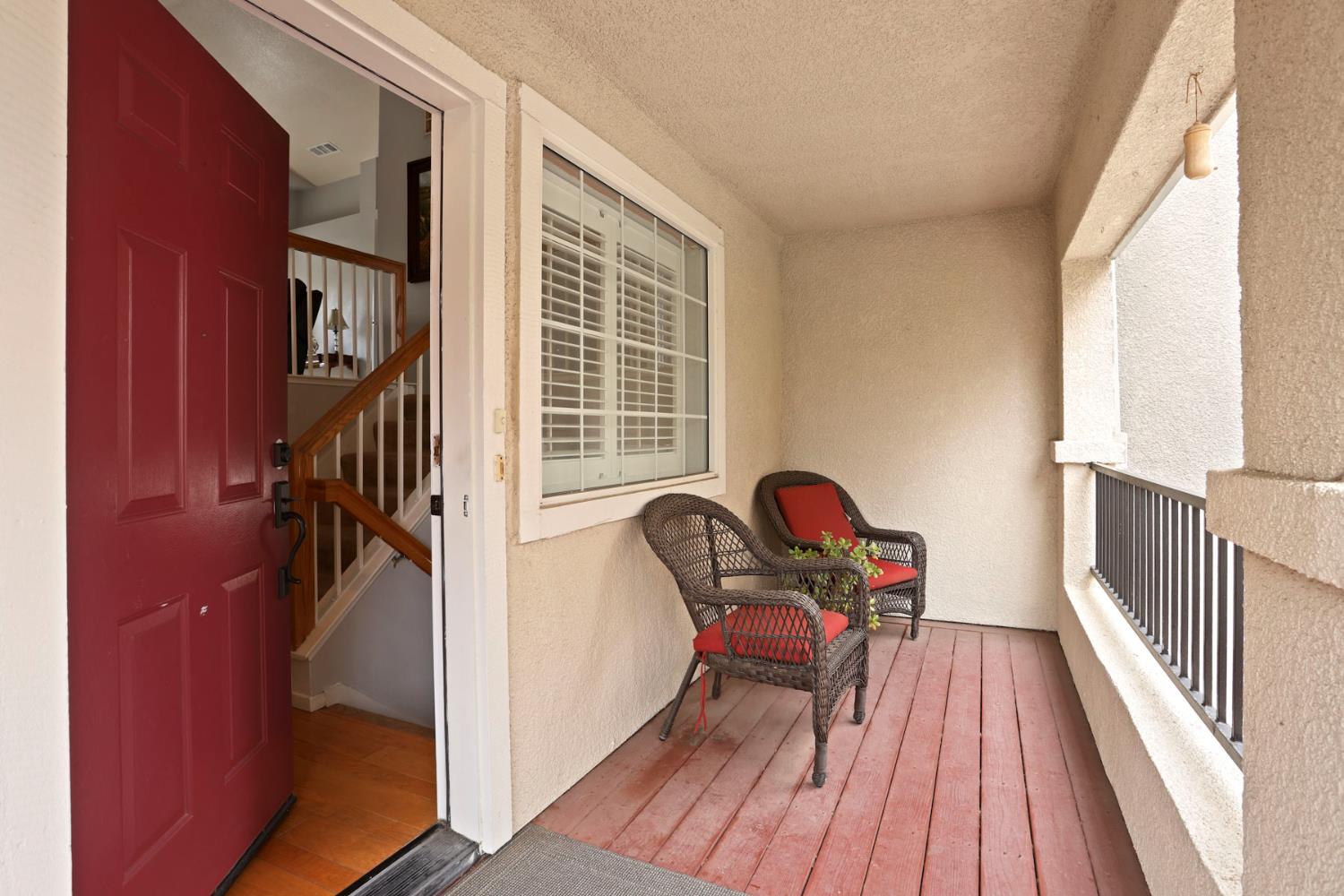 1601 Spring Court Tracy, CA 95376 - Photo 6 of 49 a view of a hallway with wooden floor and stairs