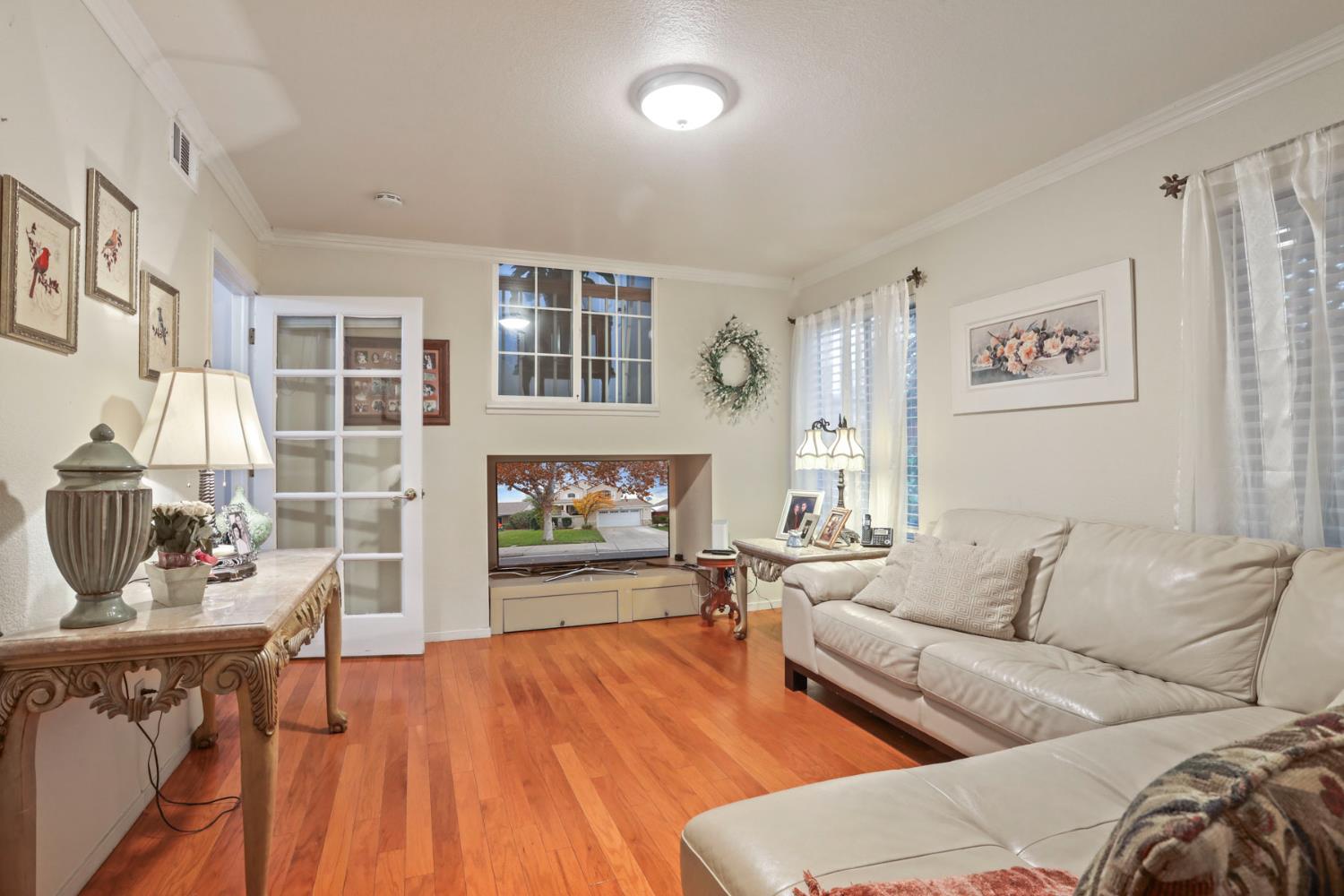 1601 Spring Court Tracy, CA 95376 - Photo 8 of 49 a living room with furniture and a fireplace