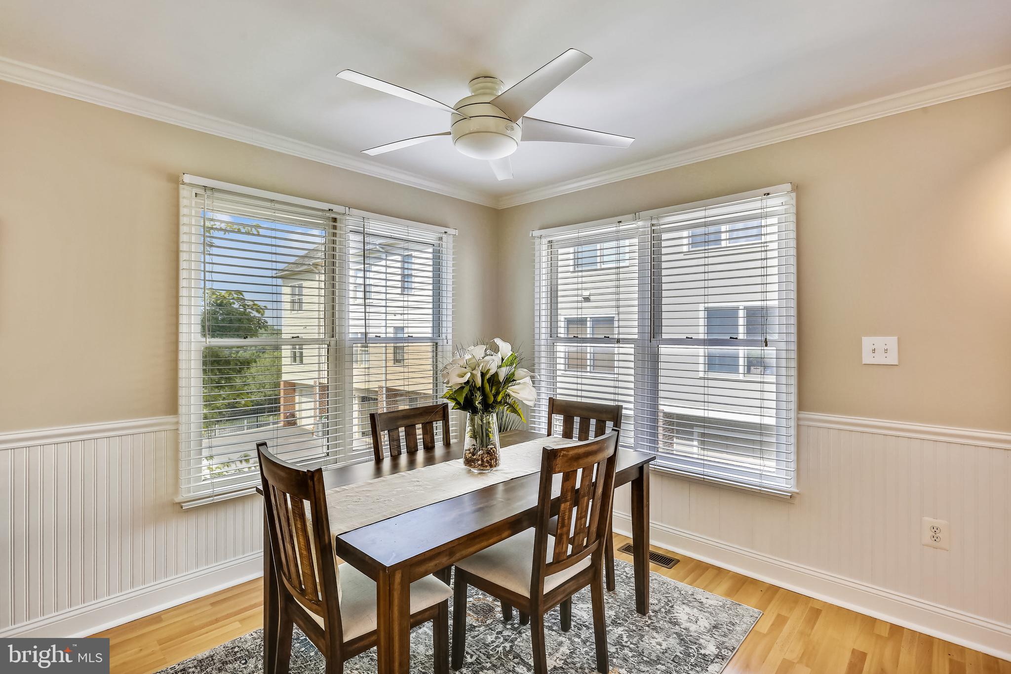 102 Ridgepoint Place Gaithersburg, MD 20878 - Photo 13 of 57 Dining area w/wainscoting & lighted ceiling fan