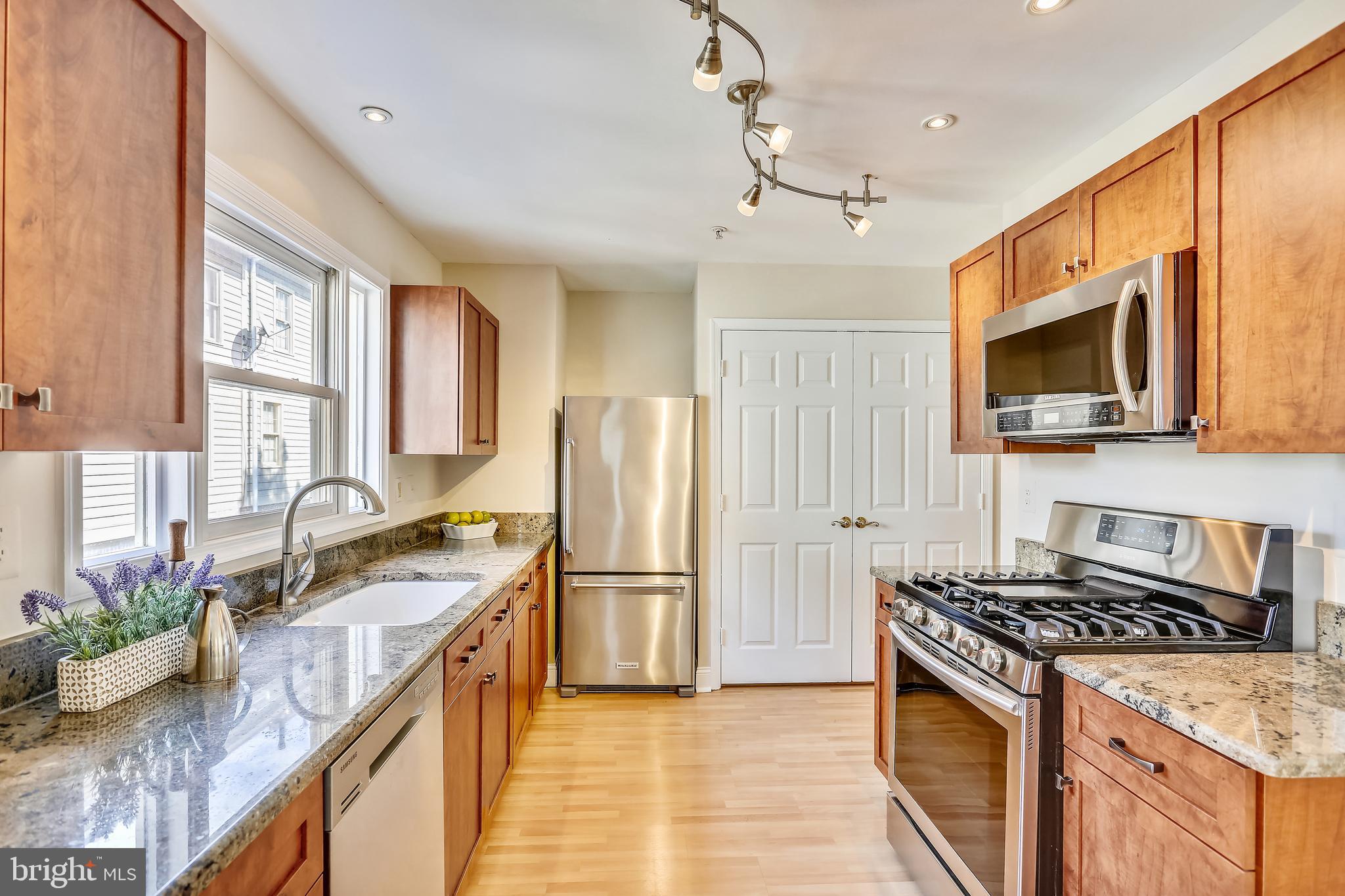 102 Ridgepoint Place Gaithersburg, MD 20878 - Photo 8 of 57 Renovated kitchen features granite & stainless