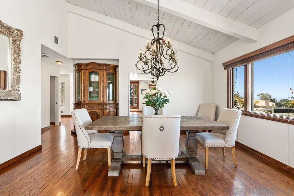 2070 De Mayo Road Del Mar, CA 92014 - Photo 11 of 43 a view of a dining room with furniture window and wooden floor