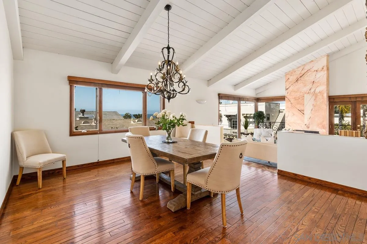 2070 De Mayo Road Del Mar, CA 92014 - Photo 12 of 43 a view of a dining room with furniture wooden floor and chandelier