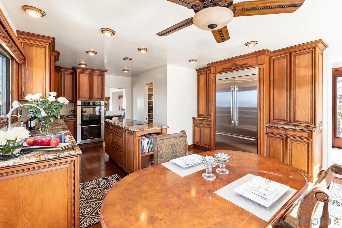 2070 De Mayo Road Del Mar, CA 92014 - Photo 15 of 43 a bed room with furniture and a chandelier