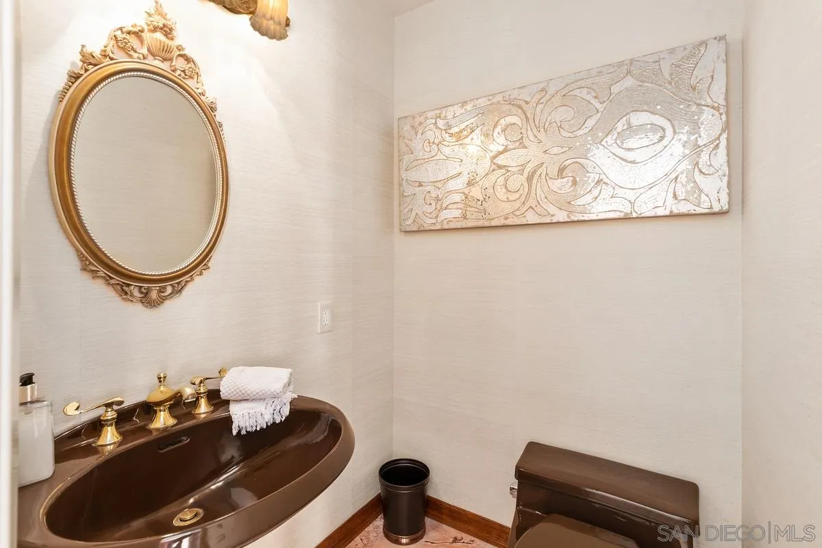 2070 De Mayo Road Del Mar, CA 92014 - Photo 17 of 43 a bathroom with a sink mirror and vanity