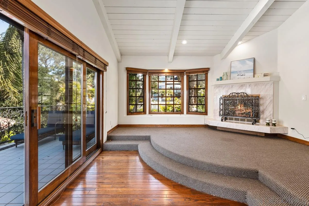 2070 De Mayo Road Del Mar, CA 92014 - Photo 18 of 43 a view of an empty room with wooden floor and a window