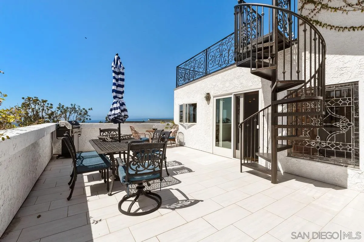2070 De Mayo Road Del Mar, CA 92014 - Photo 26 of 43 a view of a patio with table and chairs and potted plants