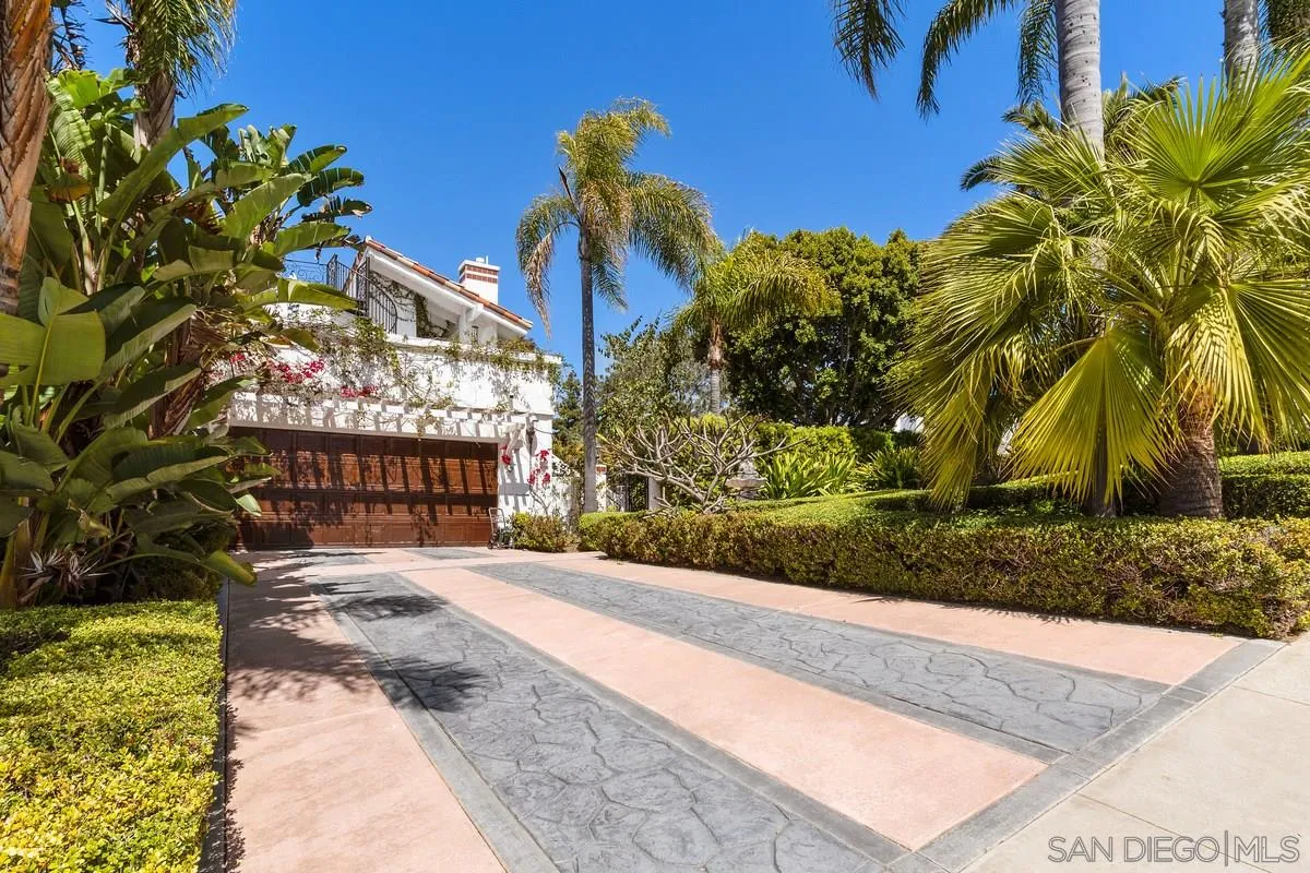 2070 De Mayo Road Del Mar, CA 92014 - Photo 3 of 43 a street view with tall buildings and a yard in front of it