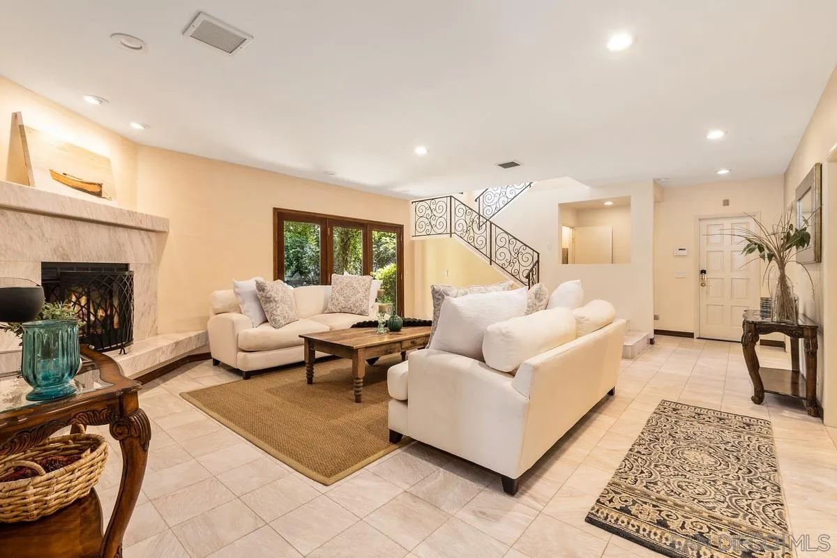 2070 De Mayo Road Del Mar, CA 92014 - Photo 33 of 43 a living room with furniture and a fireplace