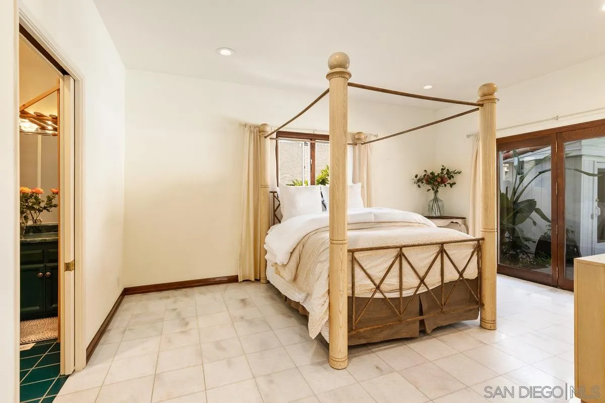 2070 De Mayo Road Del Mar, CA 92014 - Photo 35 of 43 a bedroom with a bed and a painting on the wall