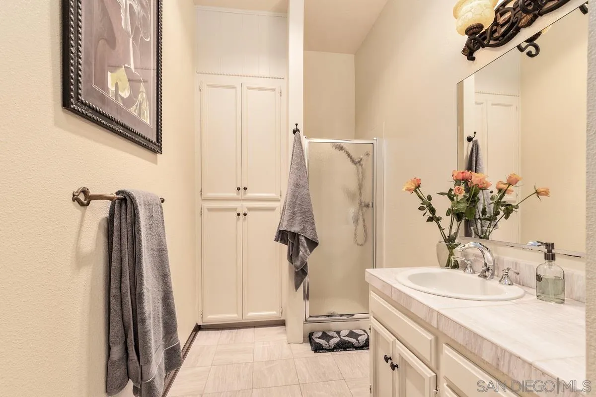 2070 De Mayo Road Del Mar, CA 92014 - Photo 38 of 43 a bathroom with a sink and a mirror