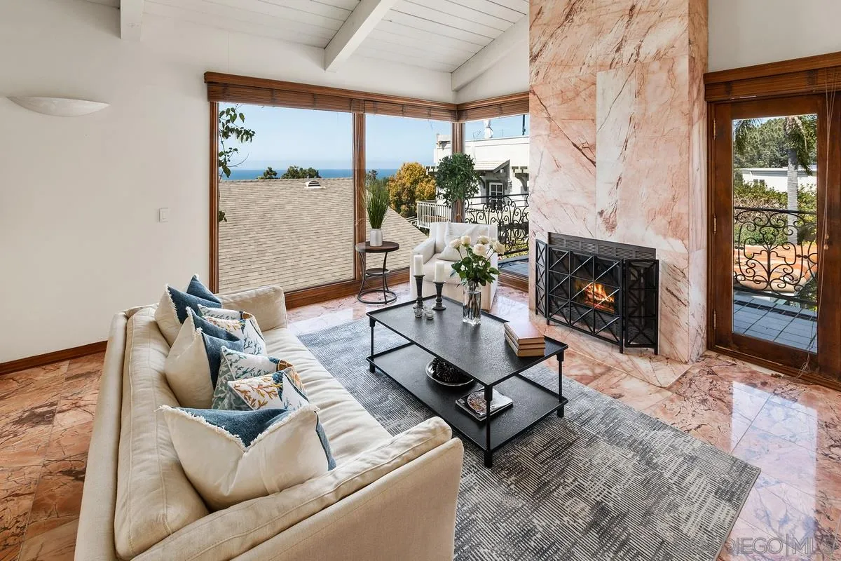 2070 De Mayo Road Del Mar, CA 92014 - Photo 9 of 43 a living room with furniture and a fireplace