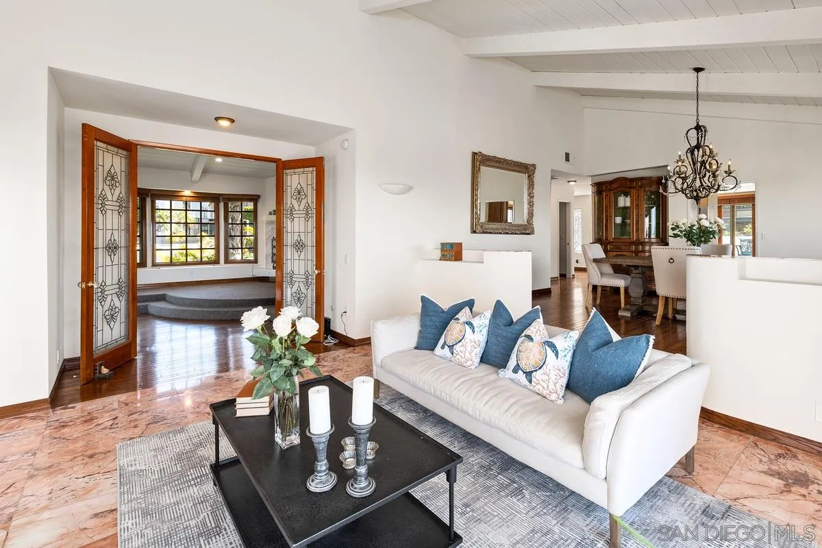 2070 De Mayo Road Del Mar, CA 92014 - Photo 10 of 43 a living room with furniture a window and a chandelier