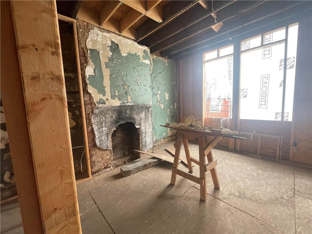712 Armandale Street Pittsburgh, PA 15212 - Photo 10 of 12 a livingroom with furniture and a fireplace
