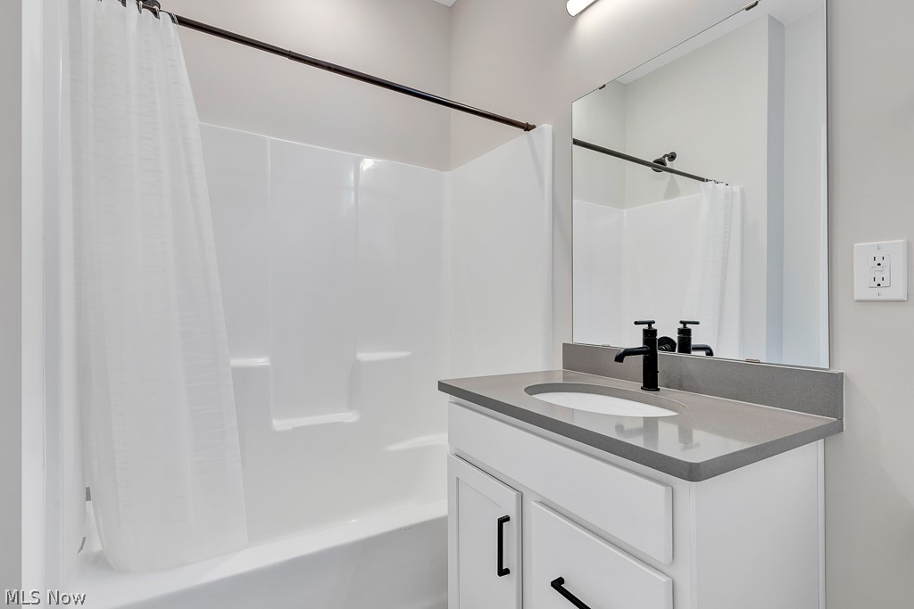 3601 Bailey Avenue Cleveland, OH 44113 - Photo 19 of 22 Bathroom featuring vanity and shower / tub combo