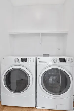 a utility room with dryer and washer