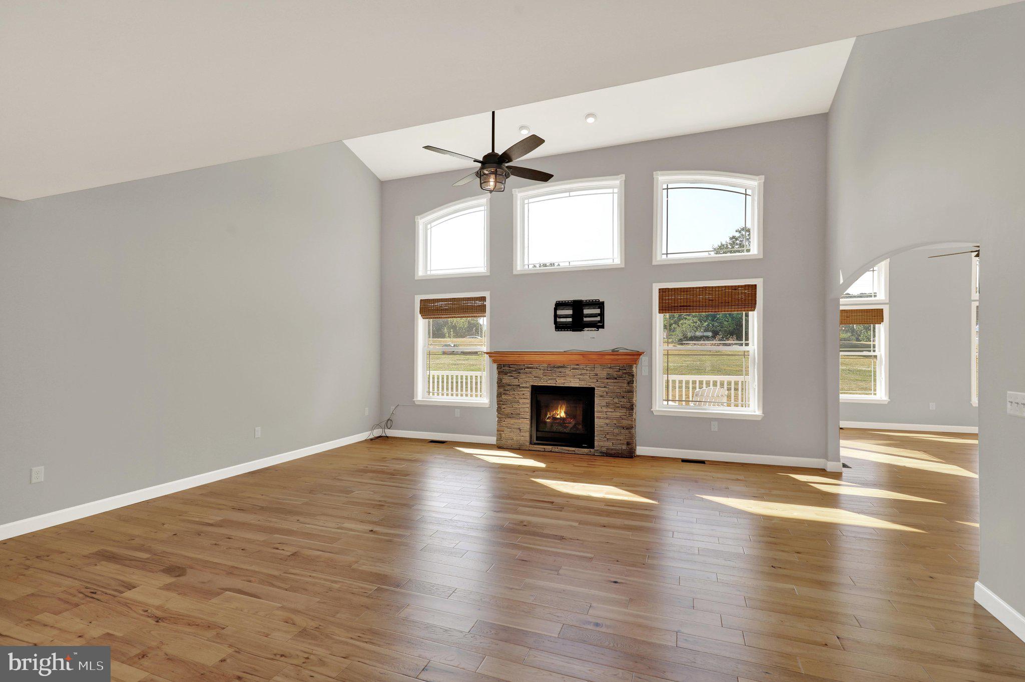 64 Middletown Road Fleetwood, PA 19522 - Photo 18 of 54 an empty room with wooden floor fireplace and windows