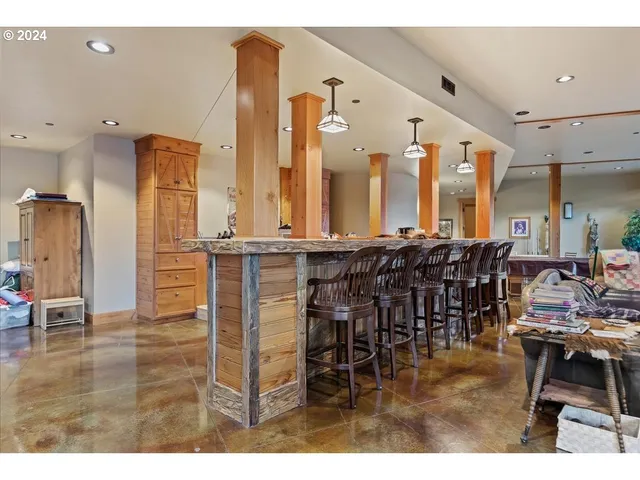 a kitchen view with wooden floor and outdoor seating