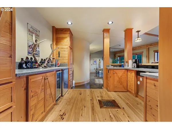 a bedroom with furniture and a wooden floor
