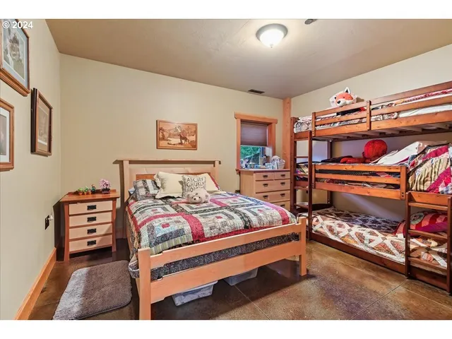 a bathroom with a sink mirror and a shower
