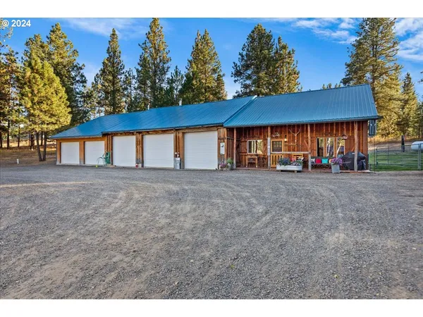 a view of a livingroom with furniture and staircase