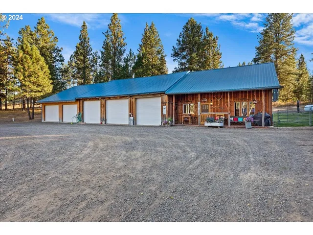 a view of a livingroom with furniture and staircase