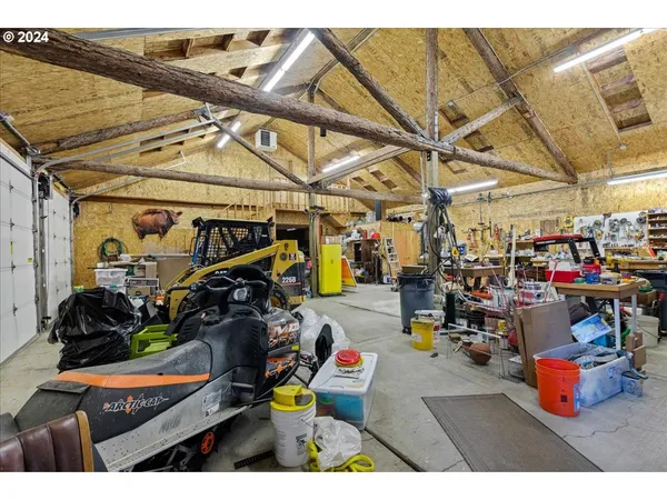 a view of a chair and table in the garden